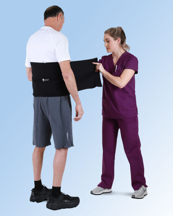 Nurse Applying the SMI Lumbar Support Wrap